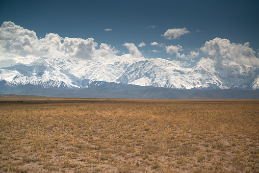 Road on the way from Bishkek to Osh with beautiful mountain range in Kyrgyzstan