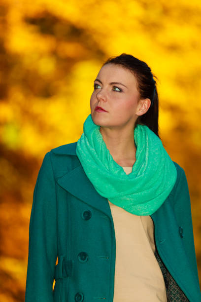 istock Woman walking in park during autumn 1195243743