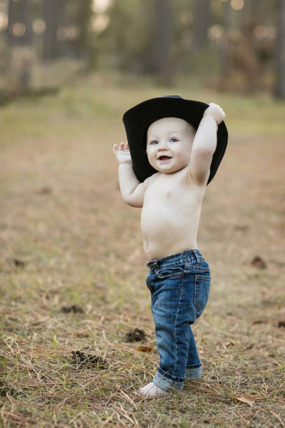 Blonde Baby Boy Jeans And A Cowboy Hat Stock Photo - Download Image Now Baby - Human Age, Cowboy, Baby Clothing - iStock
