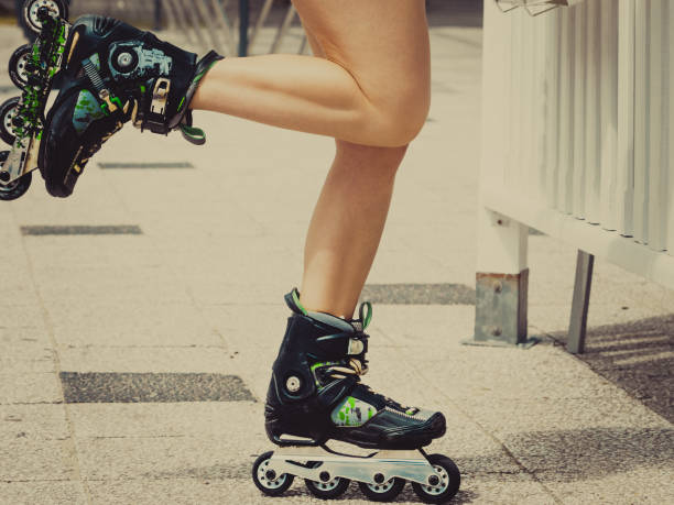 istock Woman legs wearing roller skates 1195244888