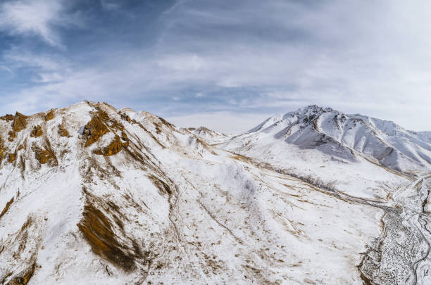 istock lanscape with barren mountain which is covered with ice 1195245270