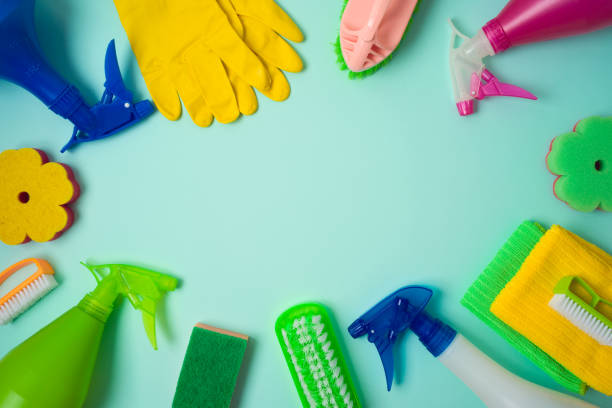 istock Spring cleaning concept with supplies over blue background. Top view from above 1195245541