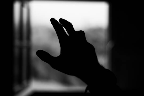 istock Hand finger black and white help body part window 1195246150