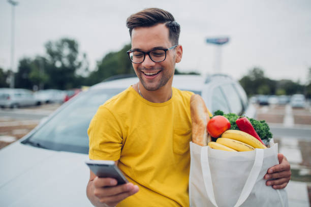 istock Handsome young man, shopping list 1195247466