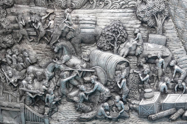 Detail of aluminium and silver bas-relief with stories of Buddhism, dharma puzzles, and the history of the Wat Sri Suphan, or silver temple in Chiang Mai, kingdom Thailand