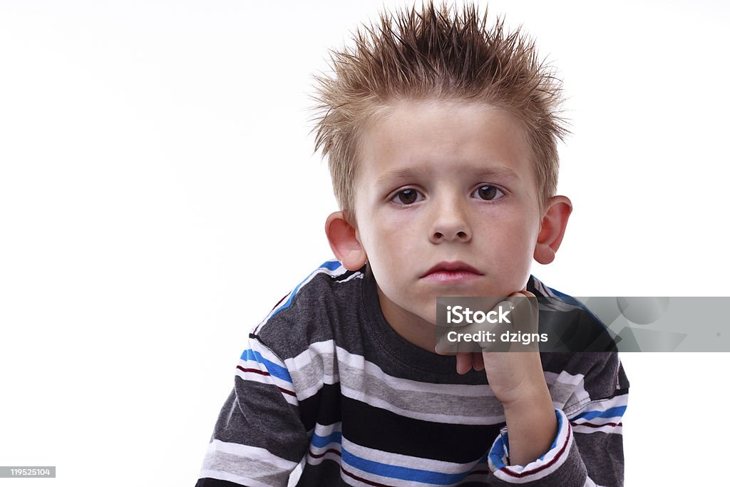 Linda young boy looking aburrido con la mano en la barbilla - Foto de stock de Amistad libre de derechos