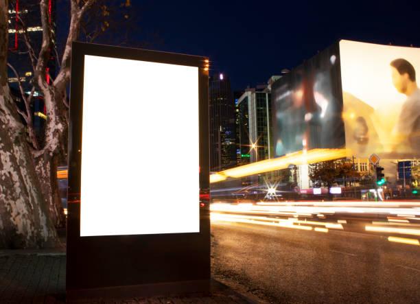 istock Billboard outdoor, advertising mockup, empty frame copy space for logo and text. Modern flat style signboard. Outdoor street banner night shot, long exposure. 1195251042