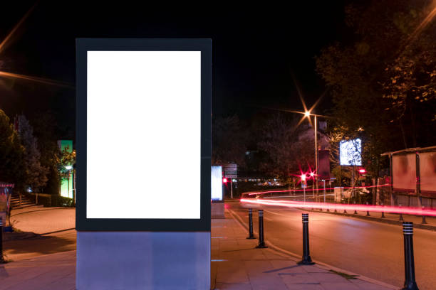 istock Billboard outdoor, advertising mockup, empty frame copy space for logo and text. Modern flat style signboard. Outdoor street banner night shot, long exposure. 1195251100