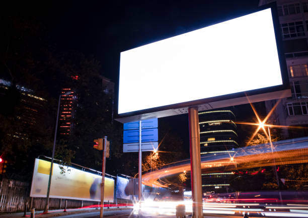 istock Billboard outdoor, advertising mockup, empty frame copy space for logo and text. Modern flat style signboard. Outdoor street banner night shot, long exposure. 1195251200