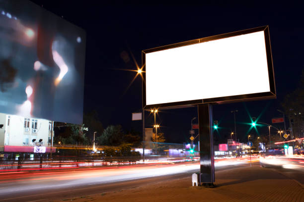 istock Billboard outdoor, advertising mockup, empty frame copy space for logo and text. Modern flat style signboard. Outdoor street banner night shot, long exposure. 1195251537