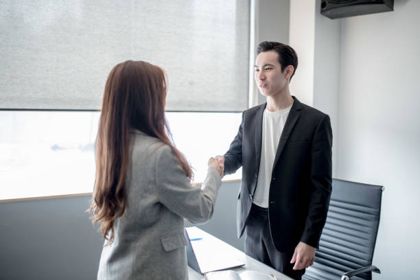 istock A young businessmen shake hand with his client. Success deal a project. 1195252859