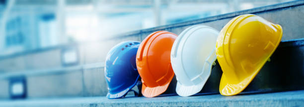 istock Multicolored Safety Construction Worker Hats. Teamwork of the construction team must have quality. Whether it is engineering, construction workers. Have a helmet to wear at work. For safety at work. 1195256762