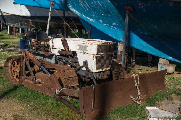 istock A small old abandoned bulldozer is rusting in a yacht yard 1195256826