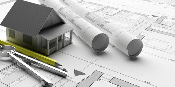 istock House model on blueprints background, engineer contractor office. 3d illustration 1195257354
