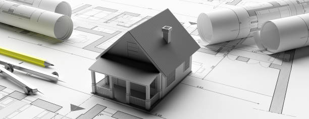 istock House model on blueprints background, engineer contractor office. 3d illustration 1195257362