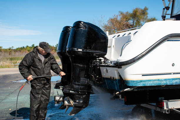 istock Caucasian man power washing boat 1195257377