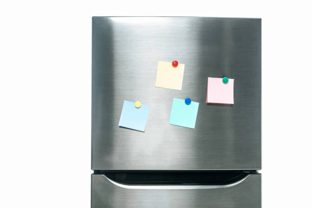 istock stainless steel fridge with blank sticky notes on freezer isolated on white 1195258019