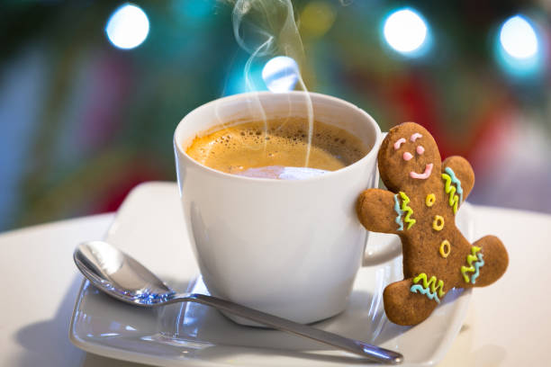 istock Gingerbread cookie man at the cup of hot coffee 1195259657
