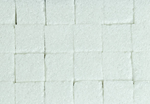 istock cubes of lump sugar laying flat on the table, texture 1195259666