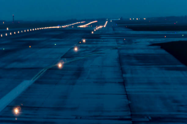 istock Airport runway illuminated at dusk 1195264145
