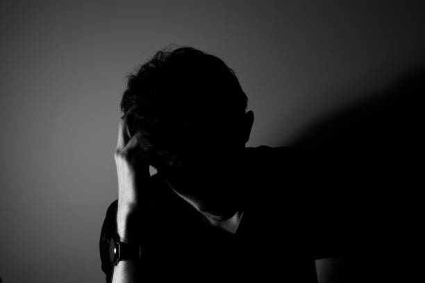 istock Young man shadows sad black and white 1195264195