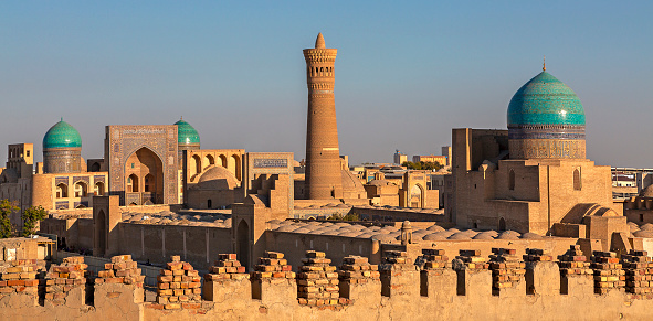 View over the Poi Kalon Mosque and Minaret at the sunset, in Bukhara, Uzbekistan.