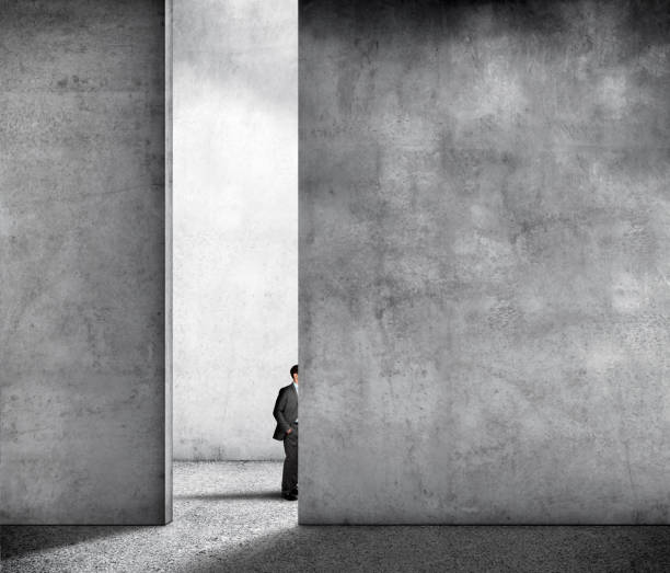 istock Partially Hidden Businessman In Large Concrete Room 1195268869