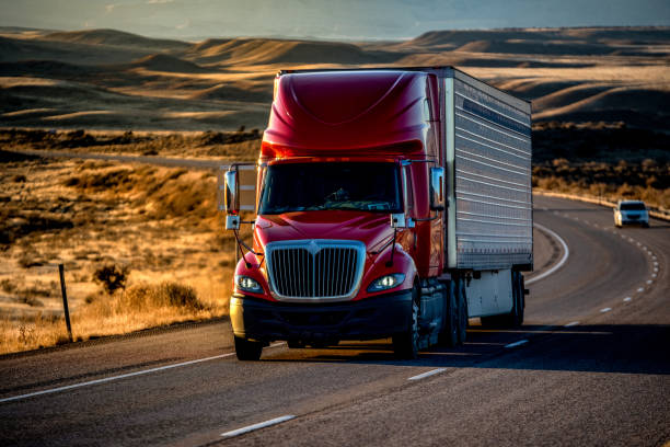 istock Long Haul Semi-Truck Rolling Down a Four-Lane Highway at Dusk 1195270041