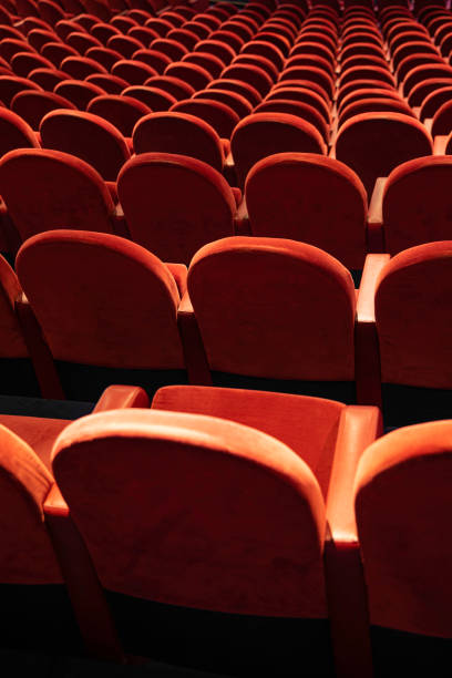 istock Empty comfortable red seats in the theatre/cinema 1195270817