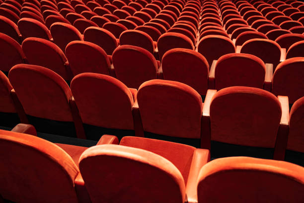 istock Empty comfortable red seats in the theatre/cinema 1195270824