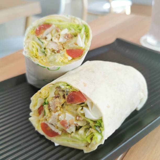istock The mixed fresh vegetable Reagan sandwich wrap healthy on black plate 1195271053