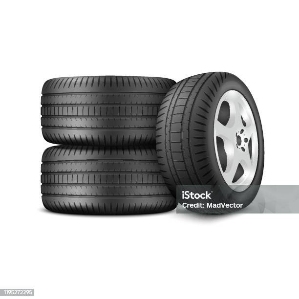 Tower Of Three Car Wheels And 1 Wheel On The Side Stock Photo