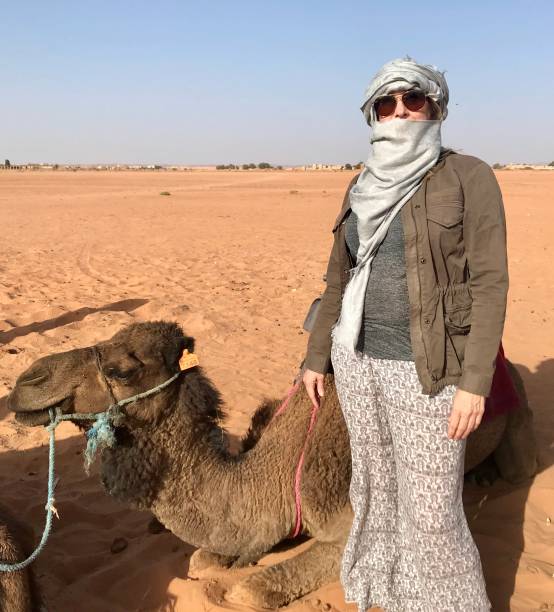 istock Solo Traveler with her camel ride 1195273174