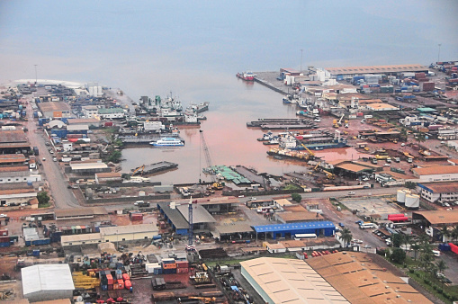 Port-Gentil aka Mandji, Gabon: the country's second-largest city and its main seaport. Currently a center for the petroleum industry. Cape Lopez peninsula was discovered in 1473 by the Portuguese navigator Lopes Gonçalves, the town was later named after the French colonial administrator Émile Gentil. View of the seaport from above. OPRAG zone.