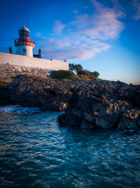 istock Lighthouse on the Rocky Shores 1195274132