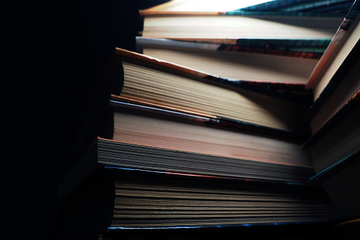 Mountain of books. Education, dark background