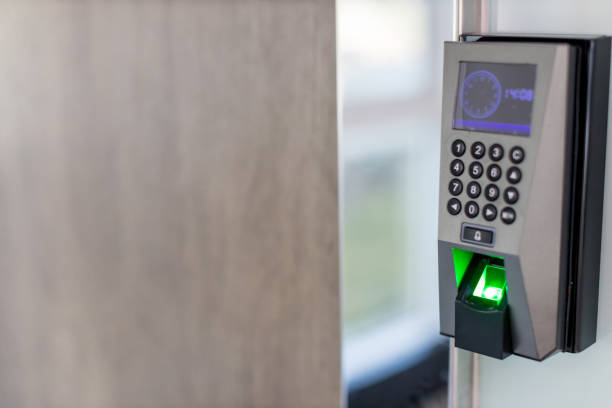 istock Finger scan on machine Security concept and safety. soft focus on hand scanning finger on machine concept. Businessman hand scanning finger on machine,Technology concept or Business concept. 1195282255