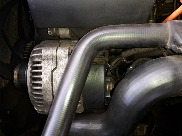istock Motor alternator in engine compartment, together with plastic cover and hoses 1195282460