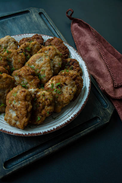 istock Pork cutlets on a plate. View from above. 1195283145
