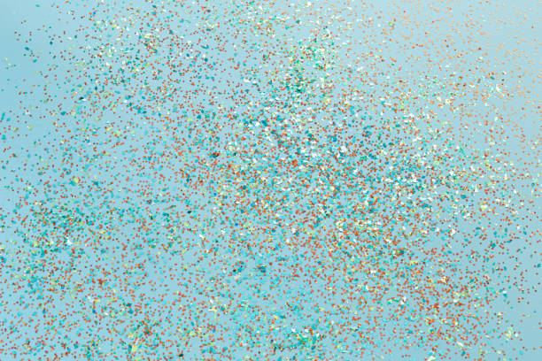 istock Beautiful blue holiday background with colored sequins 1195291719