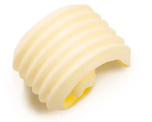 Butter or spread rolled up curl isolated, top view