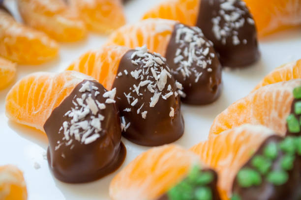istock Tangerine slices dipped in dark chocolate 1195294684