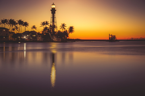 Hillsboro Inlet Lighthouse at sunrise. \nHillsboro Beach, Florida, USA.