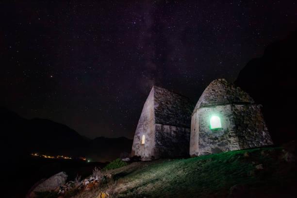 istock Night necropolis in Eltubu, Chegem Valley, Caucasus against starry sky 1195301534