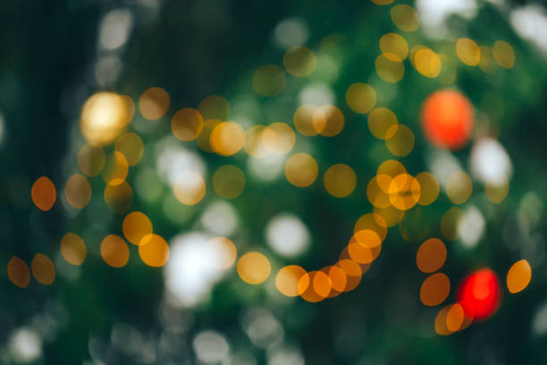 istock Christmastree background with lights 1195306905