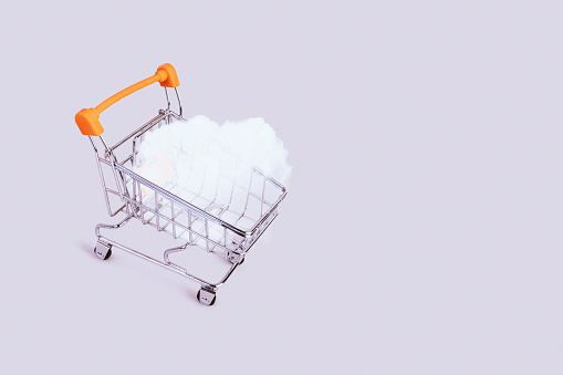 Banner with shopping cart and cloud. Grocery shopping and sale concept. Black friday, online shopping and store concept. Sale discount. Background with copyspace. Creative design. Stock photography.