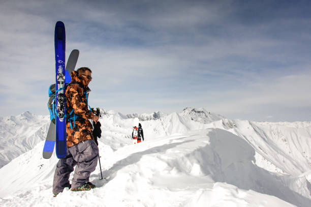 istock Man with ski and other equipment rests 1195311713