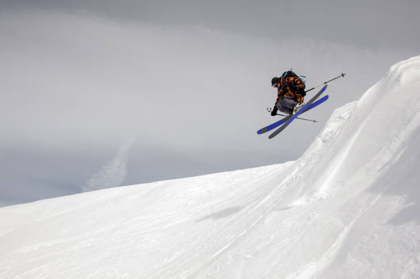 istock Skier takes off the ground while sliding down 1195311808