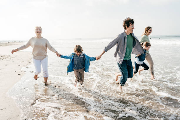istock Three generation family on the beach 1195319516