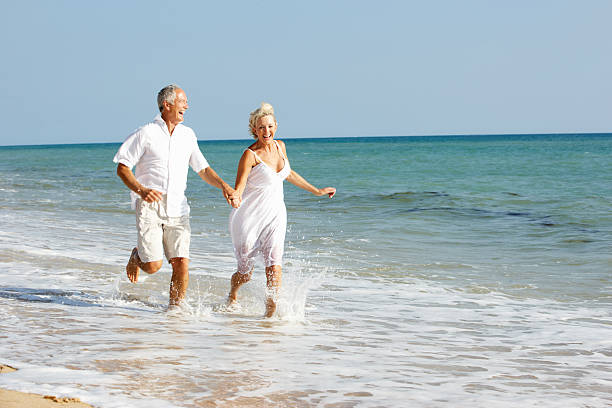 istock Senior Couple Enjoying Beach Holiday 119532893
